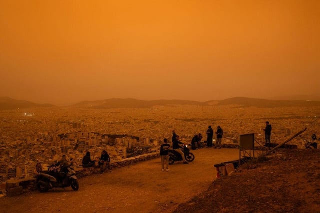 The view from Tourkovounia hill, overlooking the city of Athens, was limited due to the dust storm.