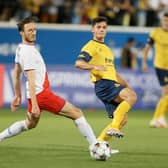 Rangers substitute Ben Davies attempts to block Union's Dante Vanzeir during Tuesday's Champions League qualifier in Belgium. (Photo by BRUNO FAHY/BELGA MAG/AFP via Getty Images)