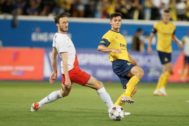 Rangers substitute Ben Davies attempts to block Union's Dante Vanzeir during Tuesday's Champions League qualifier in Belgium. (Photo by BRUNO FAHY/BELGA MAG/AFP via Getty Images)