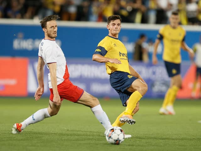 Rangers substitute Ben Davies attempts to block Union's Dante Vanzeir during Tuesday's Champions League qualifier in Belgium. (Photo by BRUNO FAHY/BELGA MAG/AFP via Getty Images)