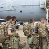 UK military personnel boarding an RAF Voyager aircraft at RAF Brize Norton