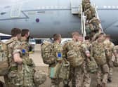 UK military personnel boarding an RAF Voyager aircraft at RAF Brize Norton