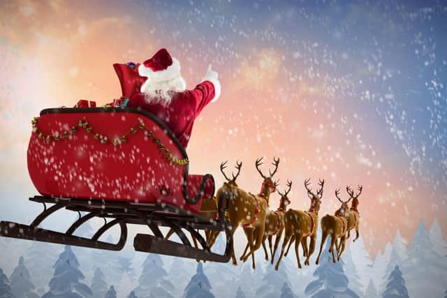 Santa will be making his epic journey, visiting every home around the world, this evening. Photo: Wavebreakmedia / Getty Images / Canva Pro.