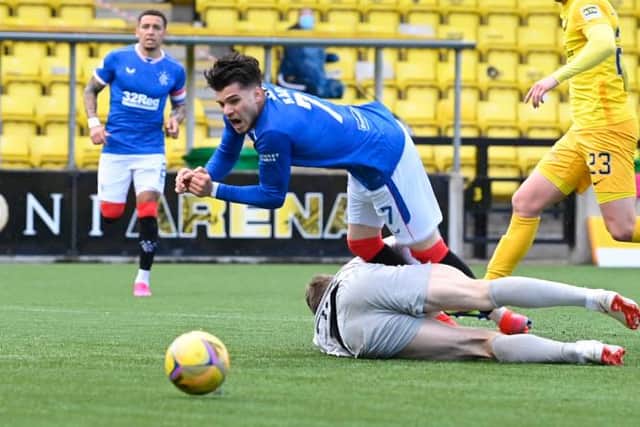 Ianis Hagi is sent sprawling by Livingston goalkeeper Max Stryjek for the penalty kick which gave Rangers the breakthrough in West Lothian. (Photo by Rob Casey / SNS Group)