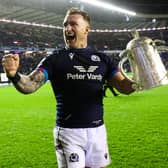 Stuart Hogg celebrates with the Calcutta Cup during a Guinness Six Nations match between Scotland and England at BT Murrayfield.