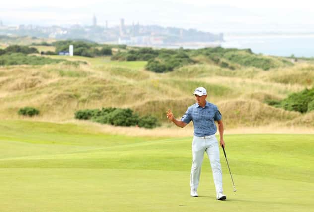 Grant Forrest waves to the crowd on the 18th green after shooting 62 in the third round of the Hero Open at Fairmont St Andrews. Picture: Andrew Redington/Getty Images.