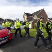 Officers from Police Scotland outside the home of former chief executive of the Scottish National Party (SNP) Peter Murrell, in Uddingston, Glasgow. Picture: Robert Perry/PA Wire