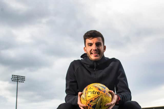 Mihai Popescu has signed a two-year deal with Hearts.