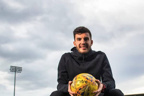 Mihai Popescu has signed a two-year deal with Hearts.
