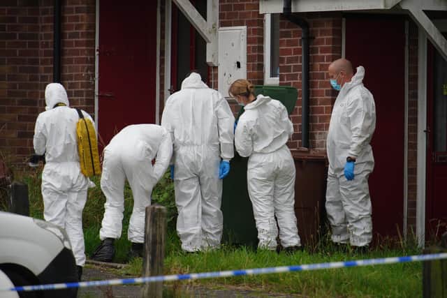 Police forensic officers in Biddick Drive in the Keyham area of Plymouth, following the deaths of six people, including the offender, who died of gunshot wounds in a firearms incident.