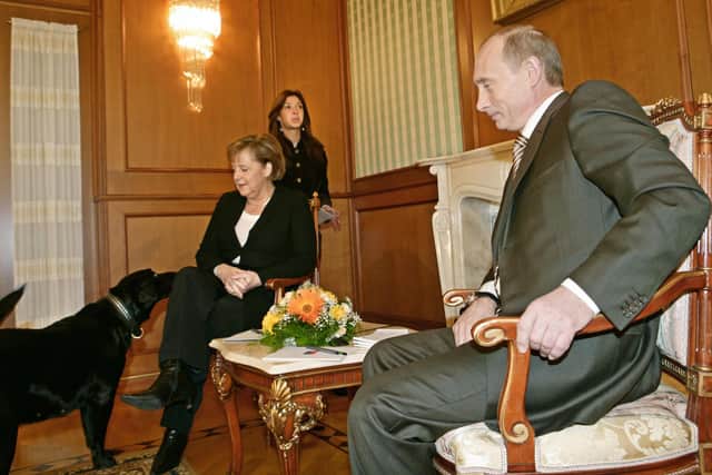 When he met German chancellor Angela Merkel in Sochi in 2007, Vladimir Putin brought his dog Kuni, even though he knew she was afraid of dogs (Picture: Axel Schmidt/AFP via Getty Images)