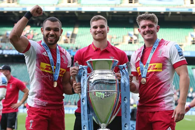 James Lang, centre, celebrates with Joe Marchant and Luke Northmore after Harlequins' victory over Exeter in the Gallagher Premiership final at Twickenham. Picture: Steve Bardens/Getty Images