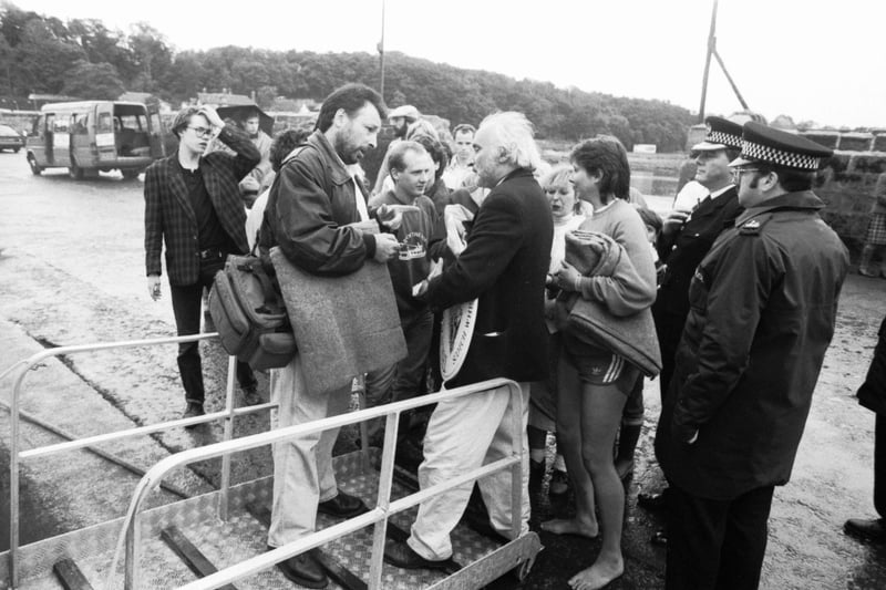 The Maid of the Forth ferry took theatre-goers to Inchcolm island in the Firth of Forth for a special production of Macbeth during Edinburgh Festival 1989. Picture shows disappointed customers with organiser Richard Demarco after the ferry was overbooked.