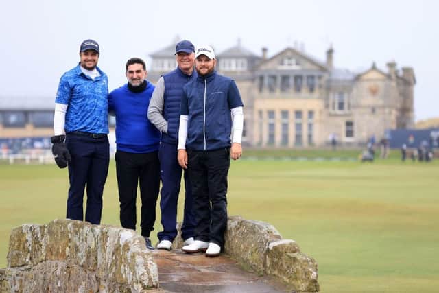 Peter Uihlein, Jordan Smith, Yasir Al-Rumayyan and Martin Slumbers pose on the Swilcan Bridge at St Andrews. Picture: Stephen Pond/Getty Images.