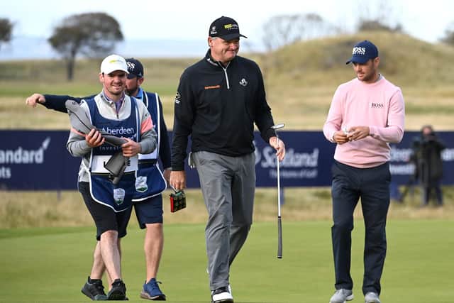 Paul Lawrie leaves the 18th green with his son and caddie Craig Lawrie after completing his last-ever round on the European Tour, having decided this week's Aberdeen Standard Investments Scottish Open at The Renaissance Club would be his 620th and final appearance. Picture: Ross Kinnaird/Getty Images