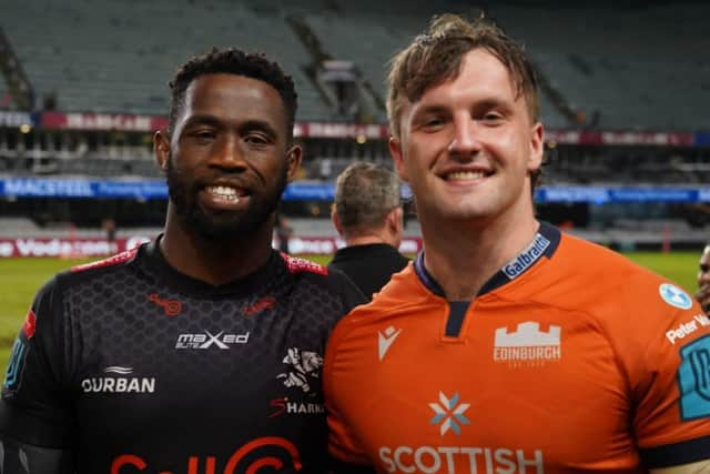 Ben Muncaster, right, got to chat to Siya Kolisi after Edinburgh's stunning win over Sharks. Picture: Joe Paolella