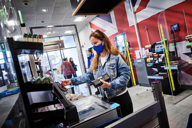 A customer shops at Aldi during the pandemic.