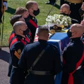 The Duke of Edinburgh's coffin, covered with his Personal Standard, is carried into St George's Chapel, Windsor Castle, Berkshire, ahead of the funeral of the Duke of Edinburgh.