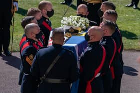The Duke of Edinburgh's coffin, covered with his Personal Standard, is carried into St George's Chapel, Windsor Castle, Berkshire, ahead of the funeral of the Duke of Edinburgh.