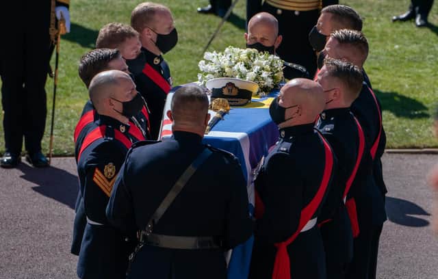 The Duke of Edinburgh's coffin, covered with his Personal Standard, is carried into St George's Chapel, Windsor Castle, Berkshire, ahead of the funeral of the Duke of Edinburgh.