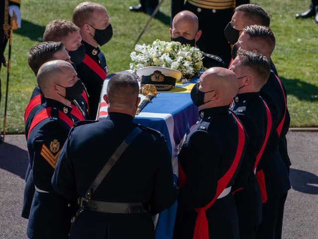 The Duke of Edinburgh's coffin, covered with his Personal Standard, is carried into St George's Chapel, Windsor Castle, Berkshire, ahead of the funeral of the Duke of Edinburgh.