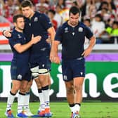 Grant Gilchrist, centre, consoles Greg Laidlaw, with Stuart McInally, right, after Scotland's defeat by Japan at the 2019 Rugby World Cup at the Yokohama International Stadium (Photo by Gary Hutchison/ SNS Group)