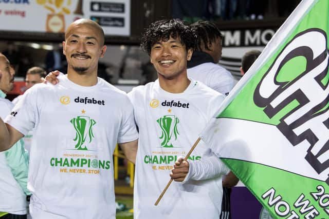 Celtic's Daizen Maeda (left) and Reo Hatate celebrate Celtic clinching the title at Tannadice with the Japanese air among the host of new recruits that were key to the club's championship drive. (Photo by Ross Parker / SNS Group)