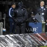 Referee Euan Anderson peers at the VAR screen during St Mirren's 2-2 draw against St Johnstone during the week.
