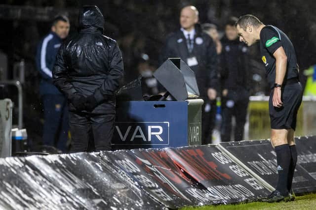 Referee Euan Anderson peers at the VAR screen during St Mirren's 2-2 draw against St Johnstone during the week.