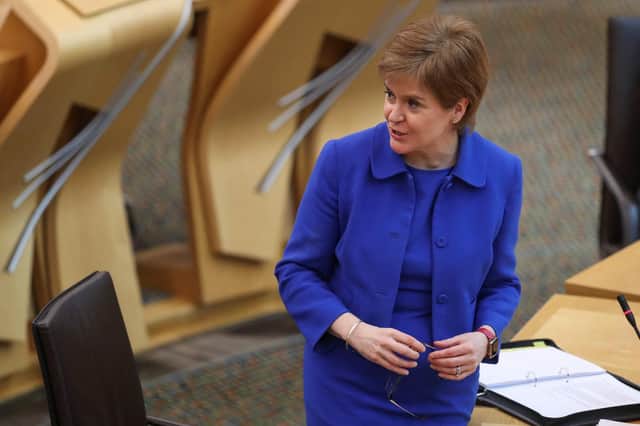 Nicola Sturgeon makes a statement in Holyrood about the plans to ease the Covid lockdown restrictions (Picture: Russell Cheyne/pool/AFP via Getty Images)