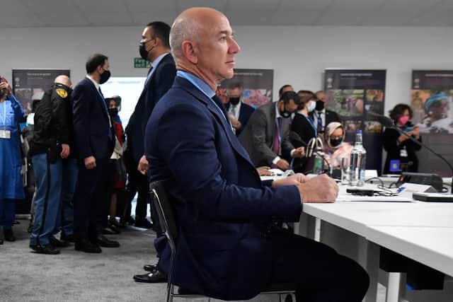US CEO of Amazon Jeff Bezos waits before a meeting with Nigeria's president, Britain's Prince of Wales and France's president as part of the World Leaders' Summit of the COP26 UN Climate Change Conference in Glasgow on November 1, 2021. Photo by ALAIN JOCARD/AFP via Getty Images.
