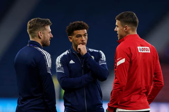 Poland's Jan Bednarek (right) greets Southampton team-mates Che Adams and Stuart Armstrong ahead of Poland's friendly with Scotland at Hampden. (Picture: Andrew Milligan/PA Wire).