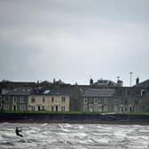 Harnessing the power of the sun, wind and waves can lead to a bright future for the UK economy, while also tackling climate change (Picture: Jeff J Mitchell/Getty Images)