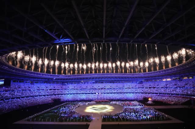 Fireworks explode during the closing ceremony in the Olympic Stadium at the 2020 Summer Olympics