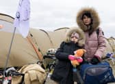 Mykhaila and her daughter from Loubny, central Ukraine, at the Polish border.