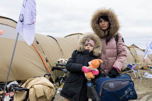 Mykhaila and her daughter from Loubny, central Ukraine, at the Polish border.