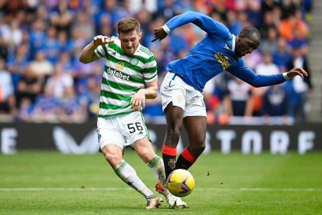 Celtic's Anthony Ralston (left) battles with Rangers' Glen Kamara at Ibrox, on August 29, 2021 (Photo by Rob Casey / SNS Group)