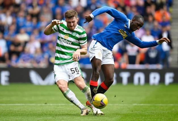 Celtic's Anthony Ralston (left) battles with Rangers'  Glen Kamara at Ibrox, on August 29, 2021 (Photo by Rob Casey / SNS Group)