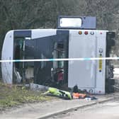 The scene on the A39 Quantock Road in Bridgwater after a double-decker bus overturned in a crash involving a motorcycle. Picture date: Tuesday January 17, 2023.