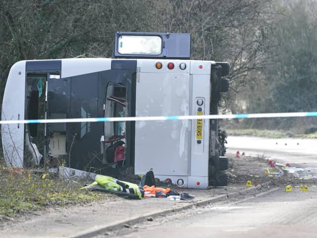 The scene on the A39 Quantock Road in Bridgwater after a double-decker bus overturned in a crash involving a motorcycle. Picture date: Tuesday January 17, 2023.
