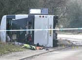 The scene on the A39 Quantock Road in Bridgwater after a double-decker bus overturned in a crash involving a motorcycle. Picture date: Tuesday January 17, 2023.