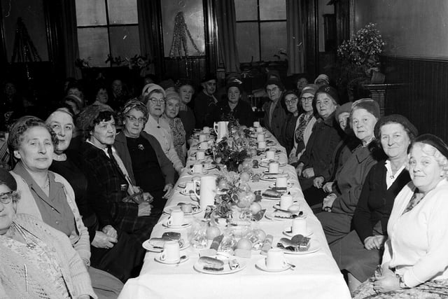 Members of the Edinburgh and Leith Old Peoples' Welfare Council Good Companions Club enjoying their annual Christmas party in the Drummond Hall in 1962.