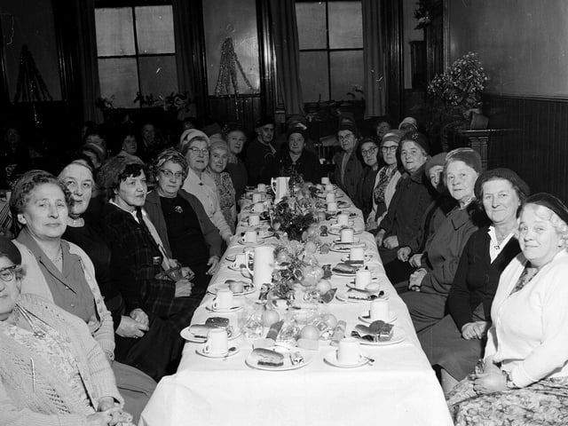 Members of the Edinburgh and Leith Old Peoples' Welfare Council Good Companions Club enjoying their annual Christmas party in the Drummond Hall in 1962.