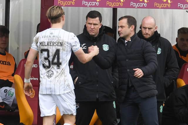 Shaun Maloney congratulates Elias Melkersen after his two goals for Hibs.
