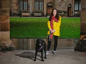 Dr Ilyena Hirskyj-Douglas, with her ten-year-old dog Zack during an experiment with the DogPhone.
