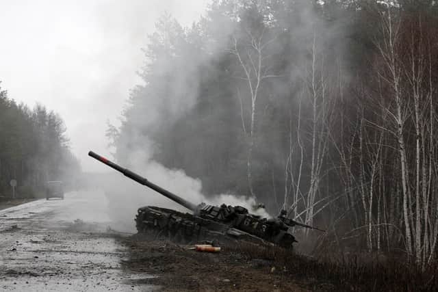 Smoke rises from a Russian tank destroyed by the Ukrainian forces in the Lugansk region (Picture: Anatolii Stepanov/AFP via Getty Images)