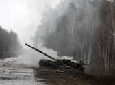 Smoke rises from a Russian tank destroyed by the Ukrainian forces in the Lugansk region (Picture: Anatolii Stepanov/AFP via Getty Images)