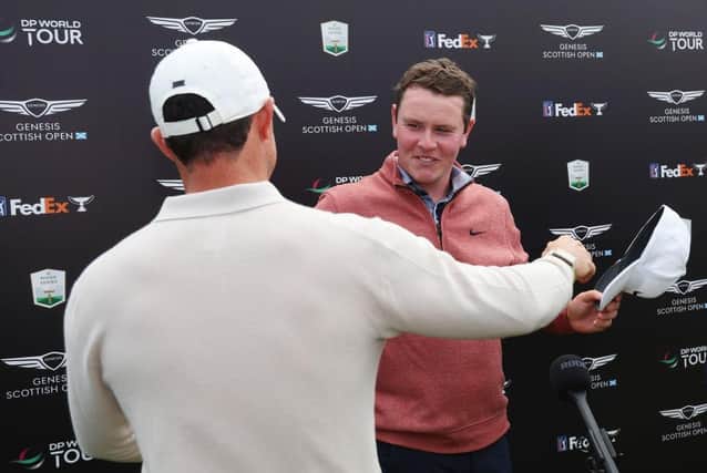 Rory McIlroy embraces Bob MacIntyre after the pair had found themselves involved in a thrilling late title battle in the Genesis Scottish Open in East Lothian. Picture: Andrew Redington/Getty Images.