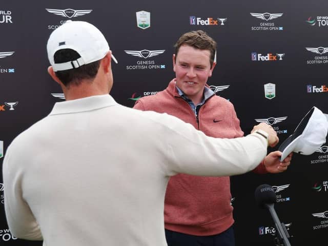 Rory McIlroy embraces Bob MacIntyre after the pair had found themselves involved in a thrilling late title battle in the Genesis Scottish Open in East Lothian. Picture: Andrew Redington/Getty Images.