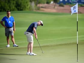 Bob Macintyre is watched by his coach, David Burns, during the pro-am event prior to the DP World Tour Championship at Jumeirah Golf Estates. Picture: Ross Kinnaird/Getty Images